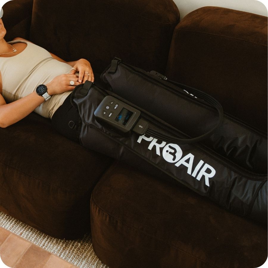 Relaxing on the couch in PROAir Wireless compression boots