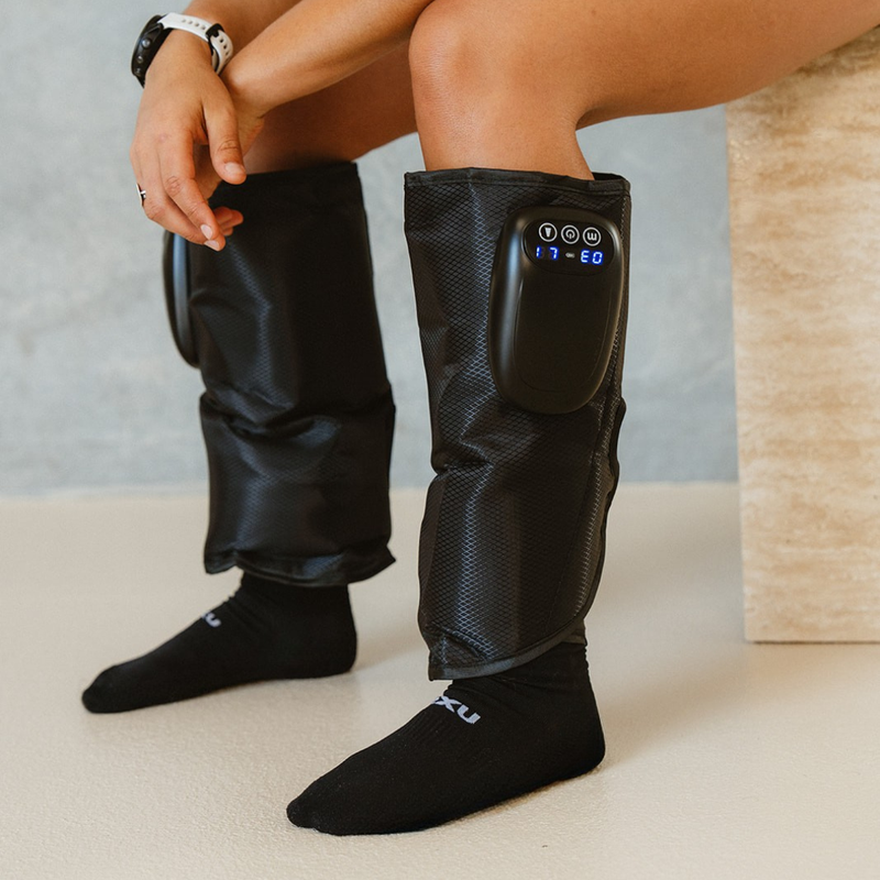 PROLite Compression sleeves on the calves, showing the built-in control panel