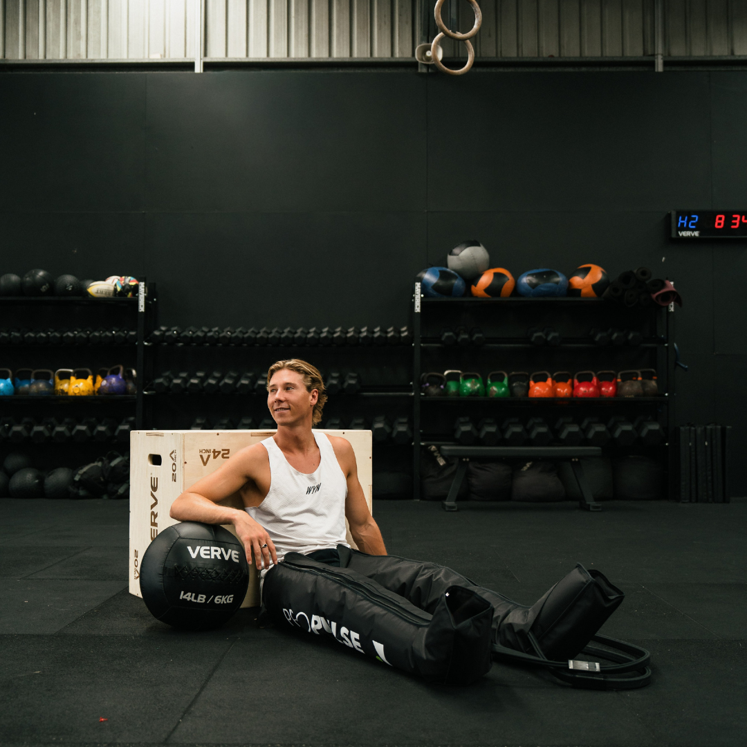 Athlete in a gym wearing PROPulse compression boots